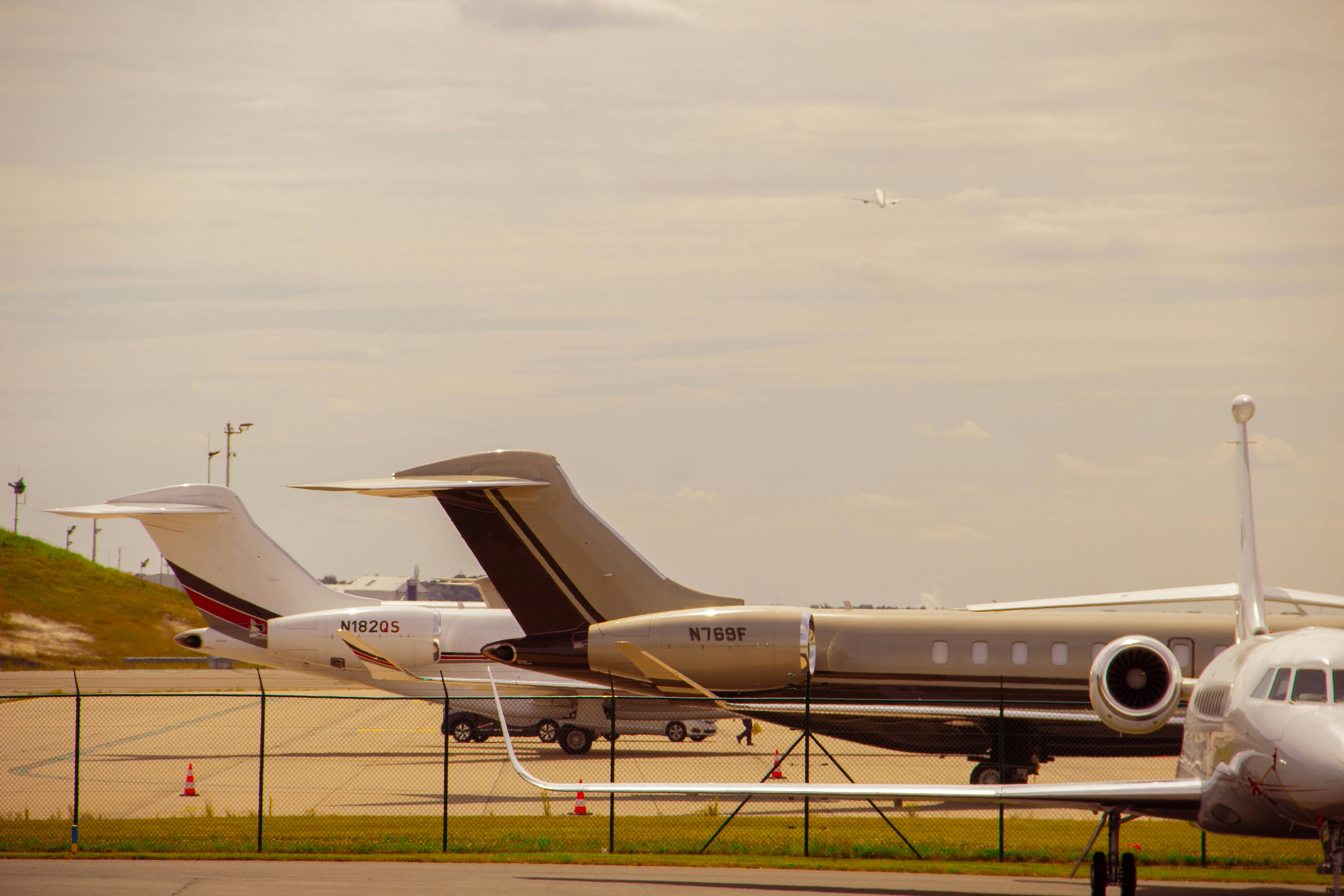 A couple of planes are parked on the runway